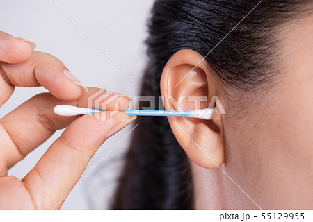 Close up young asian woman cleaning ear Close up young asian woman cleaning ear 55129955