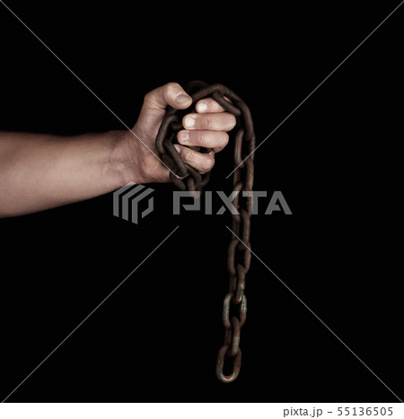 adult man in black clothes holds a brown rusty adult man in black clothes holds a brown rusty 55136505