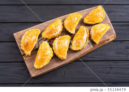 Latin American baked beef empanadas with sauce 55139479