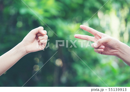 Couple play rock paper scissors hand game Couple play rock paper scissors hand game 55139913
