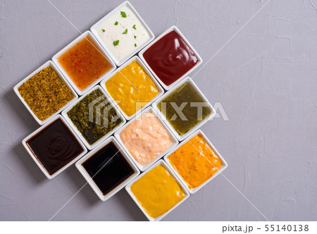 Set of different sauces in ceramic bowl 55140138