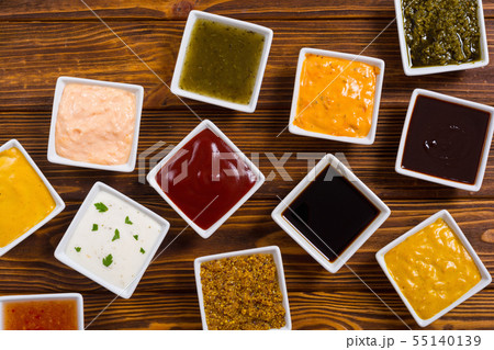Set of different sauces in ceramic bowl 55140139