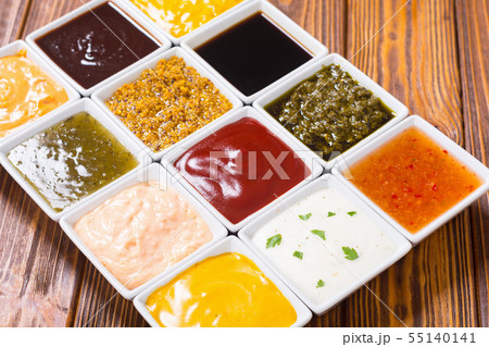 Set of different sauces in ceramic bowl 55140141