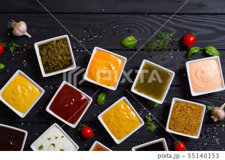 Set of different sauces in ceramic bowl Set of different sauces in ceramic bowl 55140153