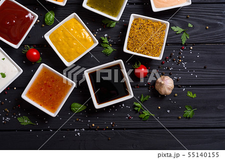 Set of different sauces in ceramic bowl 55140155