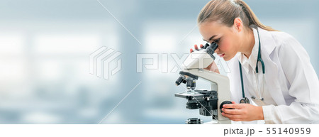 Scientist researcher uses microscope in laboratory Scientist researcher uses microscope in laboratory 55140959