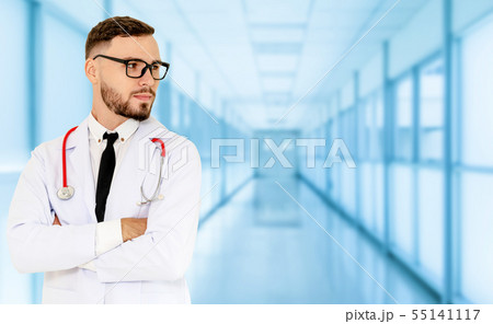 Young male doctor working at the hospital. 55141117