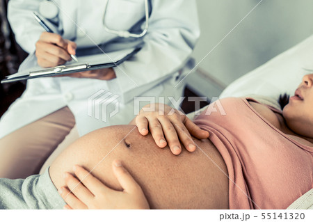 Pregnant Woman and Gynecologist Doctor at Hospital Pregnant Woman and Gynecologist Doctor at Hospital 55141320