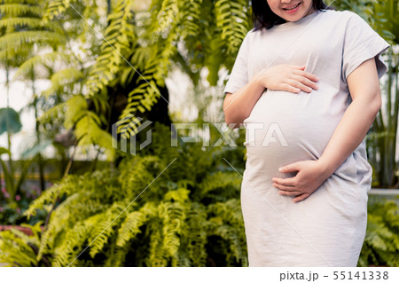 Happy pregnant woman and expecting baby at home. 55141338