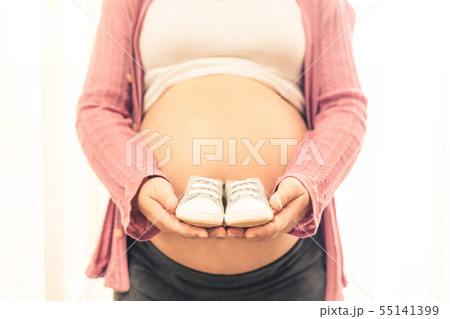 Happy pregnant woman and expecting baby at home. 55141399