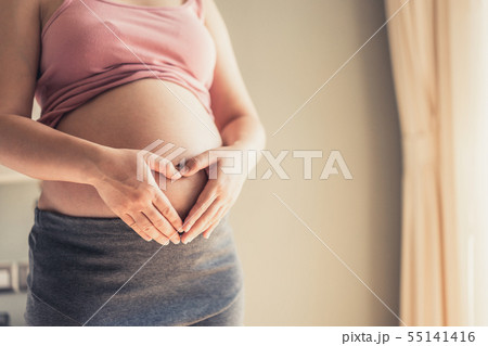 Happy pregnant woman and expecting baby at home. 55141416