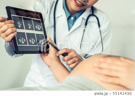 Pregnant Woman and Gynecologist Doctor at Hospital Pregnant Woman and Gynecologist Doctor at Hospital 55141430