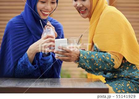 Pretty muslim women taking selfie 55141929