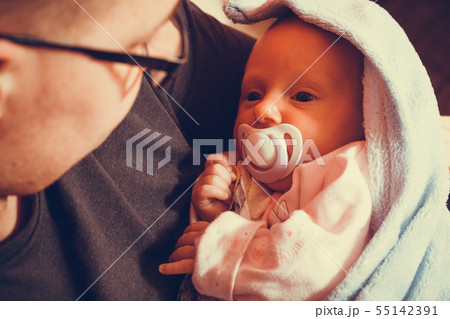 Father holding taking care of newborn baby Father holding taking care of newborn baby 55142391