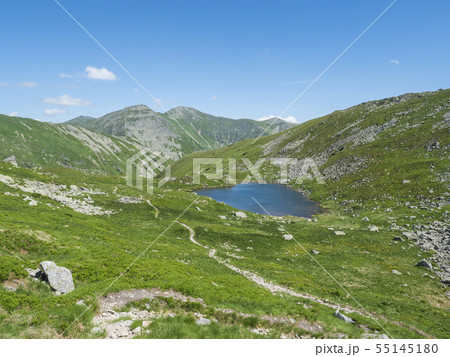 Beautiful vivid blue mountain lake Horne Jamnicke pleso with green mountain peaks view from the Beautiful vivid blue mountain lake Horne Jamnicke pleso with green mountain peaks view from the 55145180
