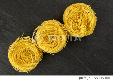 Angel hair pasta on grey stone Angel hair pasta on grey stone 55145366