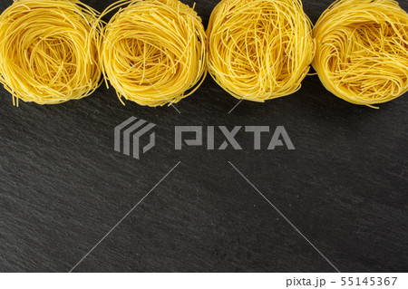 Angel hair pasta on grey stone 55145367