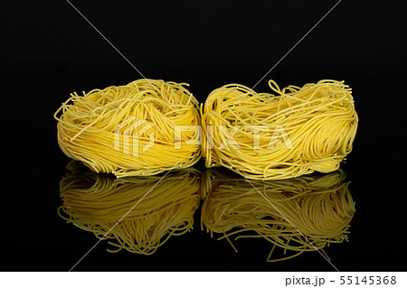 Angel hair pasta isolated on black glass Angel hair pasta isolated on black glass 55145368