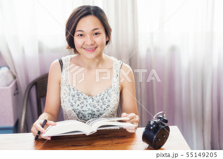Asian female student read book for final exam Asian female student read book for final exam 55149205