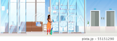 woman cleaner wiping glass wall african american female janitor using dust cloth cleaning service woman cleaner wiping glass wall african american female janitor using dust cloth cleaning service 55151290