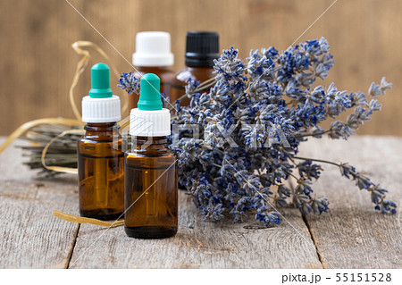 Essential oil and dry lavender flowers Essential oil and dry lavender flowers 55151528