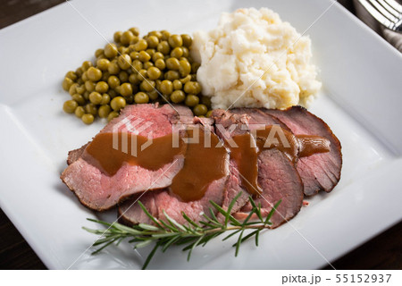 traditional roast beef served with gravy sauce, traditional roast beef served with gravy sauce, 55152937