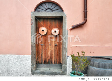 wooden old door with clay pots on the clear wall wooden old door with clay pots on the clear wall 55157473