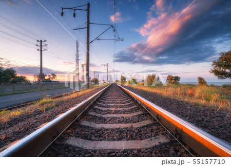 Railroad and beautiful sky at sunset in summer Railroad and beautiful sky at sunset in summer 55157710