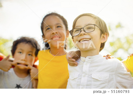 Multi-ethnic group of school kids laughing and 55160793