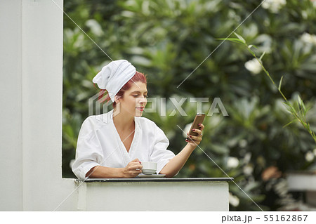Pretty woman enjoying morning coffee 55162867