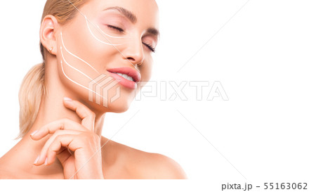 Face-lifting concept. Woman portrait with an arrows on the face. 55163062