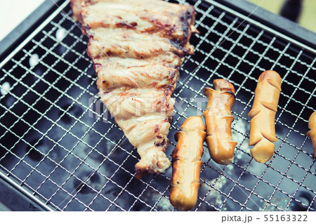 Close up grill with meat and sausage ready for Close up grill with meat and sausage ready for 55163322