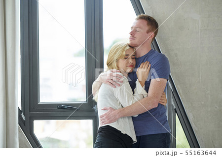 Embracing young couple 55163644