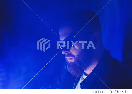 man in sunglasses smokes 55165339