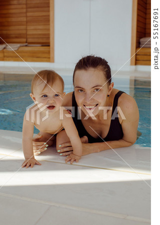Mother and baby in swimming pool Mother and baby in swimming pool 55167691