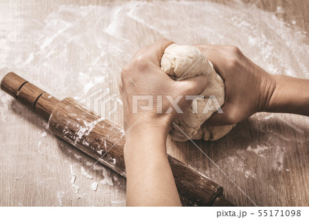woman chef kneads the dough woman chef kneads the dough 55171098