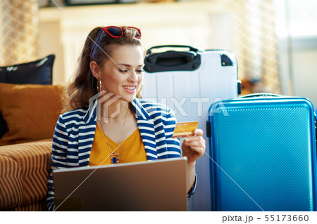 elegant woman with credit card booking tickets elegant woman with credit card booking tickets 55173660