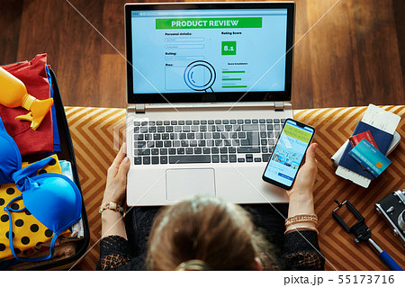 woman using online travel hotel booking website on smartphone woman using online travel hotel booking website on smartphone 55173716