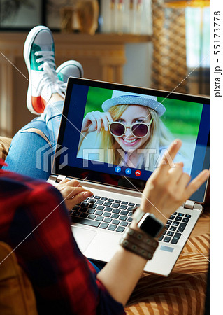 modern hipster using computer for video call on laptop 55173778