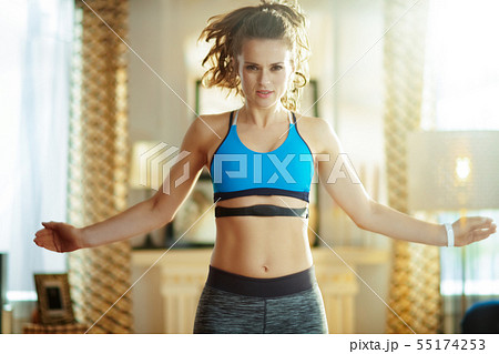 active woman workout and using heart rate monitor 55174253