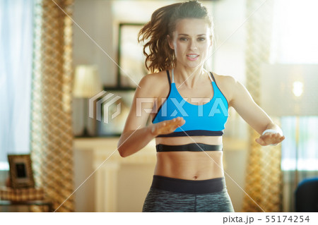 active sports woman workout and using heart rate monitor active sports woman workout and using heart rate monitor 55174254