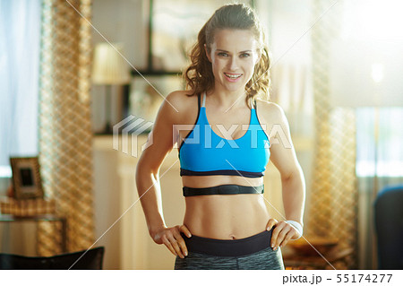 fit sports woman at modern home wearing heart rate monitor fit sports woman at modern home wearing heart rate monitor 55174277