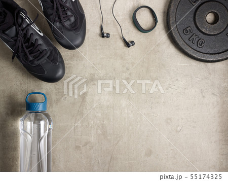 sneakers, headphones, fit tracker, bottle of water, weight plate 55174325