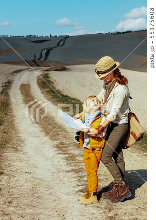 smiling modern mother and child hikers with map smiling modern mother and child hikers with map 55175608