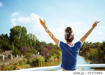 tourist woman on river boat rejoicing while having river voyage 55175866