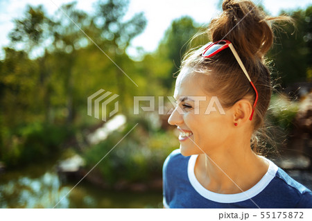 traveller woman exploring countryside while having river cruise 55175872