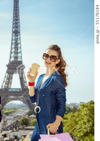 smiling stylish woman with shopping bags and coffee cup smiling stylish woman with shopping bags and coffee cup 55176184