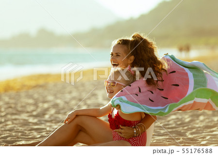 mother and child holding watermelon towel and having fun time 55176588