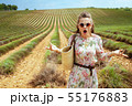 woman at green field missed flowering of lavender 55176883
