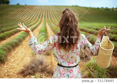 woman at green field missed flowering of lavender woman at green field missed flowering of lavender 55176885